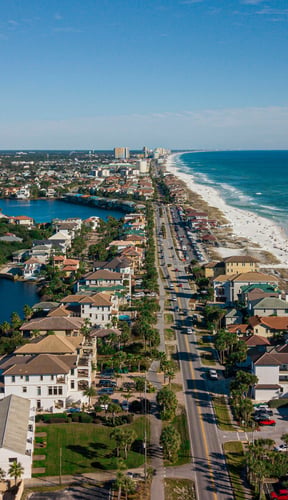 Aerial drone shot of Destin Florida white sand beach and turquoise water